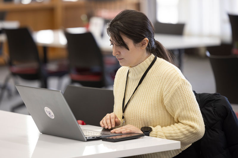 Student working on a laptop in the HSAC